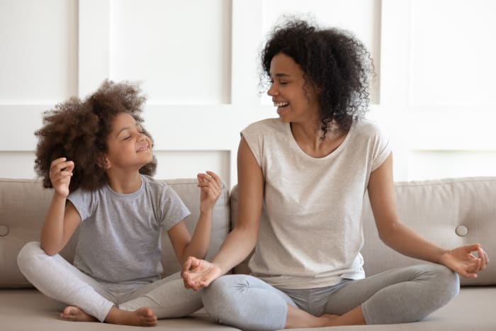 mother and son meditate together
