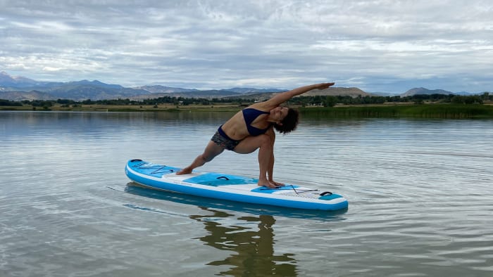 Author Elizabeth Marglin practicing yoga on the Bic Sport 10’6 Beach Air SUP