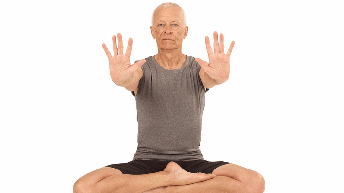 1. Stand or sit comfortably and reach your arms out in front of you with your fingers spread wide. 2. Bend your wrists as if you are trying to touch your elbows with your fingers. 3. Rotate your hands outwards by moving your hand as far as you can in the direction of your little finger. Keep rotating to extend your wrist back to point your fingers towards the sky and continue rotating, letting the thumb lead. 4. Repeat five times, then change direction to rotate five times in the opposite direction, making sure you rotate only from the wrist and not the elbow.See also Learn How to Protect Your Wrists in Your Practice