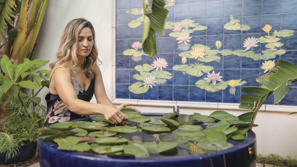 Rosie Acosta looking at lily pad
